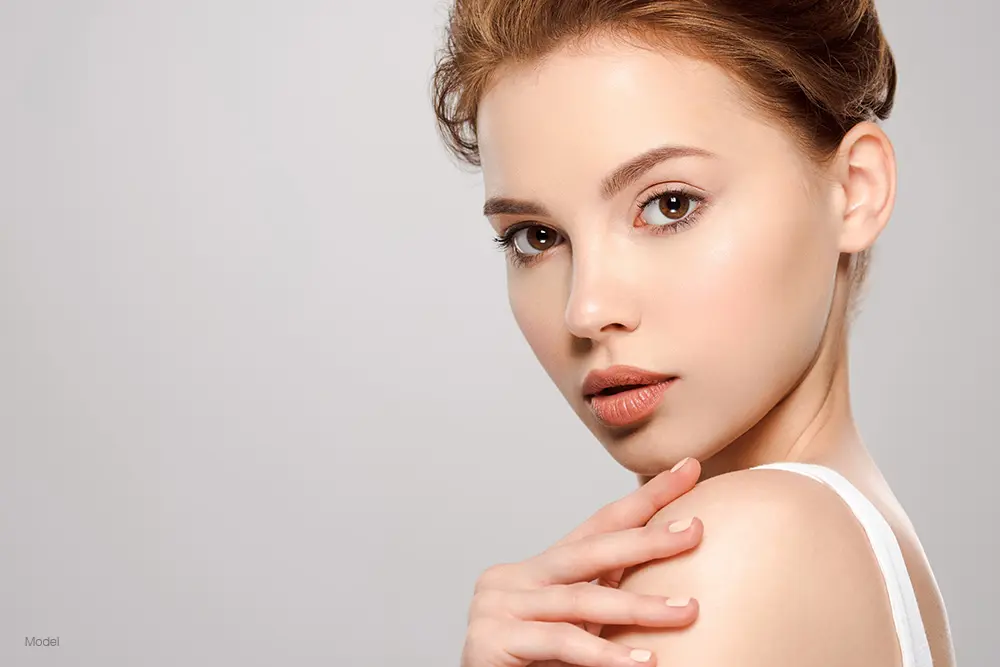 Profile of a young woman with red hair