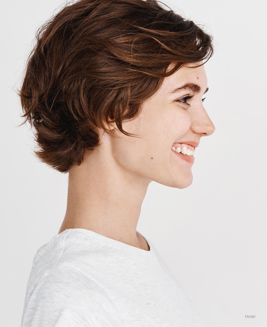 Profile of a young woman with short hair